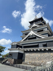 Kumamoto Castle Tower Against a Bright Blue Sky