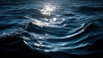 Sunlight glimmers on the crests of gentle waves at dusk, creating a serene atmosphere on the water's surface near the shore. The calming colors invite relaxation