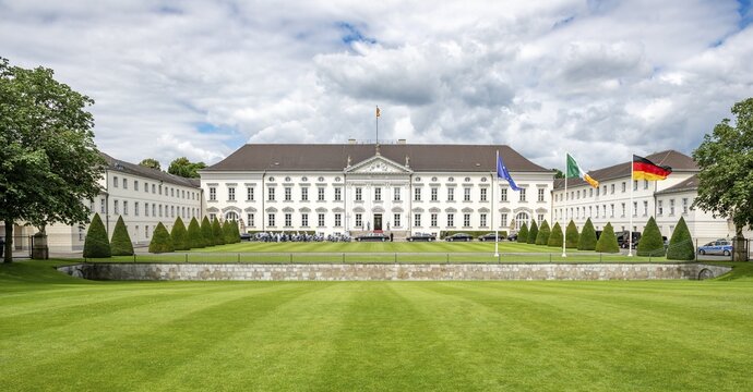 Bellevue Castle with Europe, Ireland and German flag, official residence of the German Federal President, Berlin, Germany