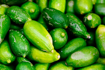 A bunch of green lemons