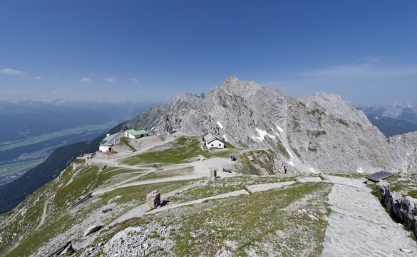 View down from the 2334m high Hafelekarspitze Mountain towards the Hafelekar mountain station and Seegrube Mountain, including the Inn Valley, Tyrol, Austria, Europe