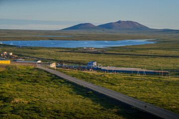 Chukotka landscape with the road, and mountains in remote Russian Arctic region close to Alaska.
