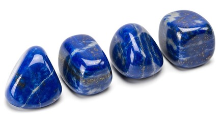 Four Polished Lapis Lazuli Gemstones with Gold Flecks on White Background mineral rock
