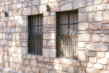 Two windows on a stone building