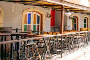 Patio with a railing and tables
