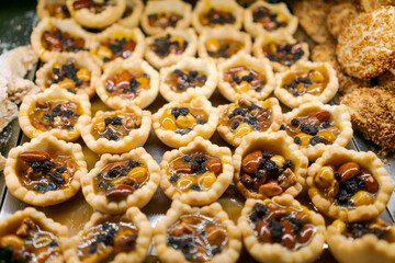 Tray of pastries with nuts and berries