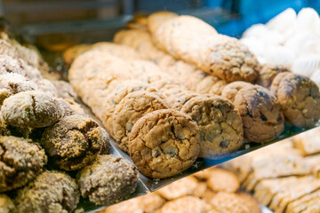 Display of cookies with a variety of flavors including chocolate chip