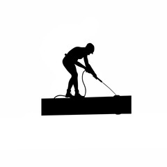 Fototapeta premium Silhouette of a skilled technician meticulously cleaning the surface of an industrial pipeline