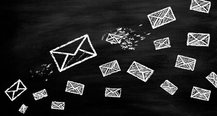 Chalk drawing of many email envelopes in flight