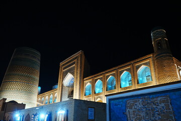 Kalta-minor Minaret and Walled Fortress known as Itchan Kala in Khiva, Uzbekistan -...
