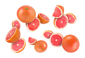 Fresh grapefruits swirling in air against white background