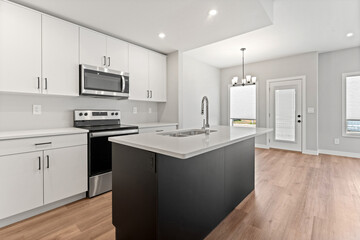 Kitchen with a black island and a white stove