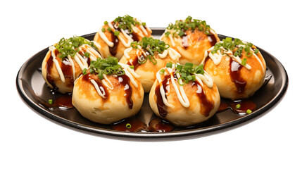 A close up shot of takoyaki balls on a black plate drizzled with sauce and topped with green onions