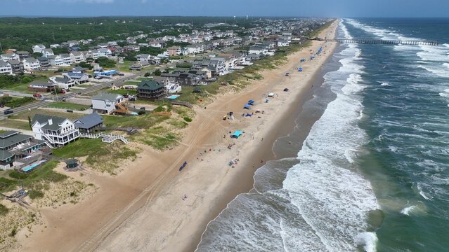 Outer Banks, NC Kill Devil Hills beach houses and real estate on coastline popular summer vacation destination for relaxing by the beach