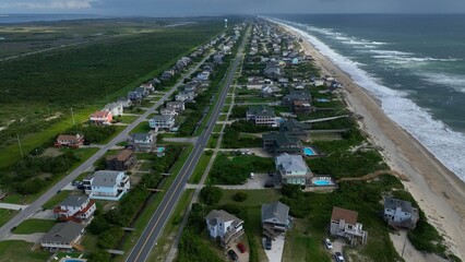 Beach front homes and real estate coastal living in Nags Head, NC by Outer Banks beaches relaxing lifestyle and summer vacation destination