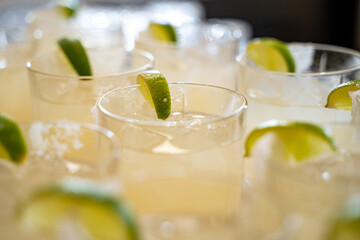 Close up of margarita cocktails with lime and salt.