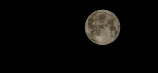 A stunning full moon glows against a dark night sky, perfect for astronomy, wellness, and...