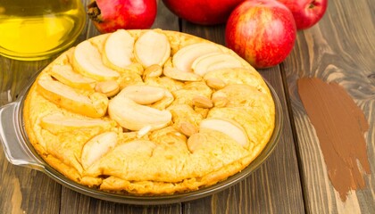 Delicious Apple Cake with Nuts and Apples on Wooden Tabletop.