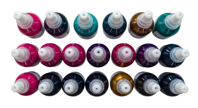 Vibrant inks shine in overhead shot with glossy texture. Use for crafting, arts, colorful designs, product advertising, or vibrant backdrops.