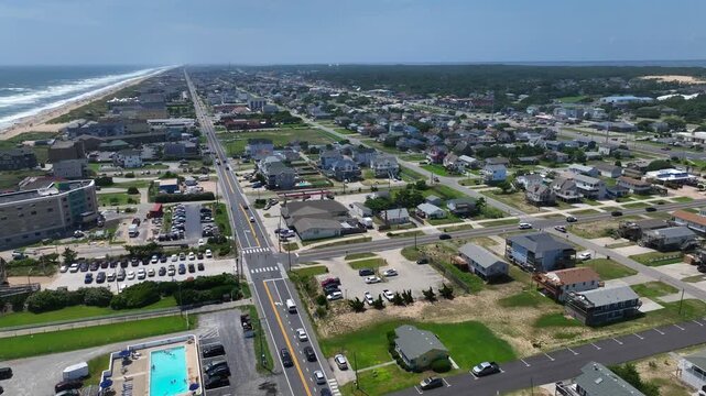 Outer Banks, NC Kill Devil Hills beach houses and real estate on coastline popular summer vacation destination for relaxing by the beach