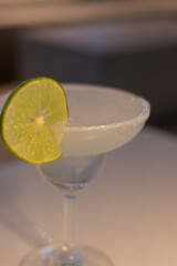 Margarita with soft light in cozy moment, a margarita is a cocktail consisting of tequila, triple sec, and lime juice.