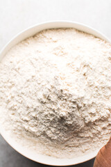 overhead view of All purpose flour in a bowl, top view of baking flour