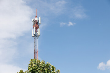 Communication towers on blue sky, 5G networks post. Network cell site. Omni direction data link