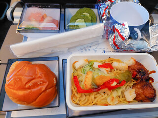 The main course is takoyaki fried noodles in the airplane meal