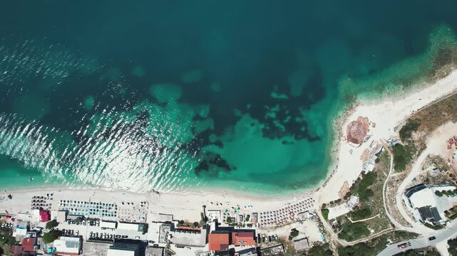Breathtaking aerial view of the Vlore coastline in Albania, showcasing crystal-clear waters, sandy beaches, and a serene coastal landscape, perfect for relaxation and summer vacations