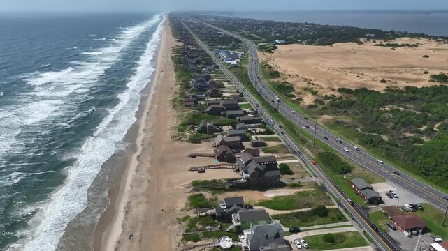 Tallest Sand Dune on Atlantic Coast Outer Banks Naga Head, North Carolina called the living dune popular for hang gliding and kit flying