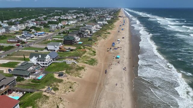 Outer Banks, NC Kill Devil Hills beach houses and real estate on coastline popular summer vacation destination for relaxing by the beach