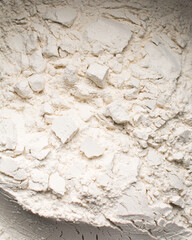overhead view of All purpose flour in a bowl, top view of baking flour	