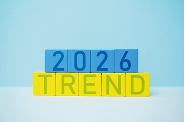 Colorful Wooden Blocks Displaying the Year 2026 and the Word Trend on Blue Background, 2026 Trend