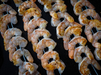 Fresh shrimp skewers prepared for grilling
