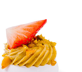 Enjoying a tasty dessert with creamy frosting and fresh strawberries