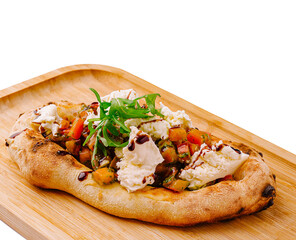 Delicious flatbread topped with fresh vegetables and creamy cheese