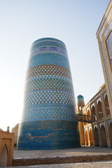 Kalta-minor Minaret and Walled Fortress known as Itchan Kala in Khiva, Uzbekistan -...