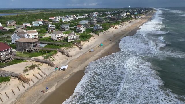 Beach front homes and real estate coastal living in Nags Head, NC by Outer Banks beaches relaxing lifestyle and summer vacation destination