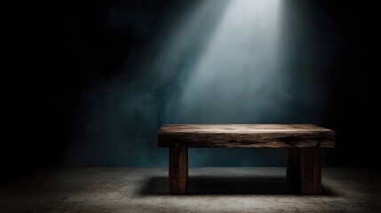 Wooden table under dramatic spotlight