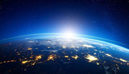 Obraz premium Earth from space with sunrise over city lights showing a beautiful planet