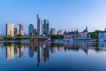 Fototapeta premium Frankfurt City Downtown Skyscrapers and Reflection in Main River at Morning Twilight. Blue Hour. Hesse, Germany