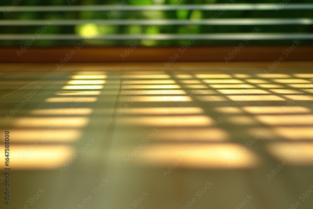Poster sunlight casts a grid pattern shadow on a wooden floor, creating a serene and peaceful atmosphere.