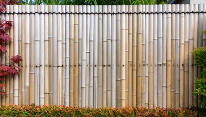 Obraz premium Bamboo fence in a garden setting
