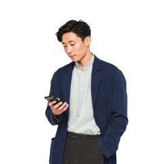 A man in a blue jacket is looking at his cell phone