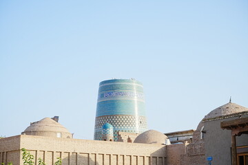 Kalta-minor Minaret and Walled Fortress known as Itchan Kala in Khiva, Uzbekistan -...