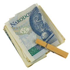 Folded Polish Zloty banknotes held by laundry clip