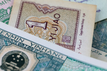 The laid Renminbi banknotes create a financial theme