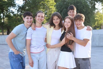 Portrait of happy teenage friends together outdoors