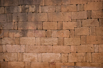 Texture of an old stone wall. Background of a stone wall texture of an old castle. A stone wall as a background or texture. Part of a stone wall, for background or texture. Old brick wall texture