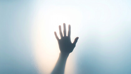 A human hand reaches against a foggy glass surface, softly lit from behind, creating a mysterious and ethereal feel.

